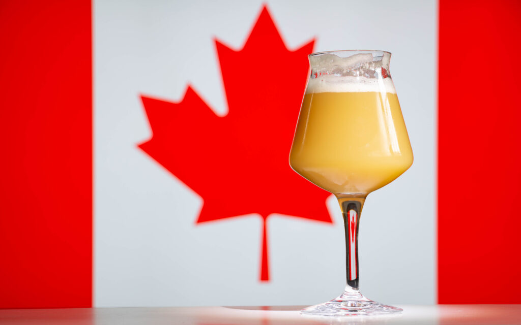 beverage in front of a Canadian flag 