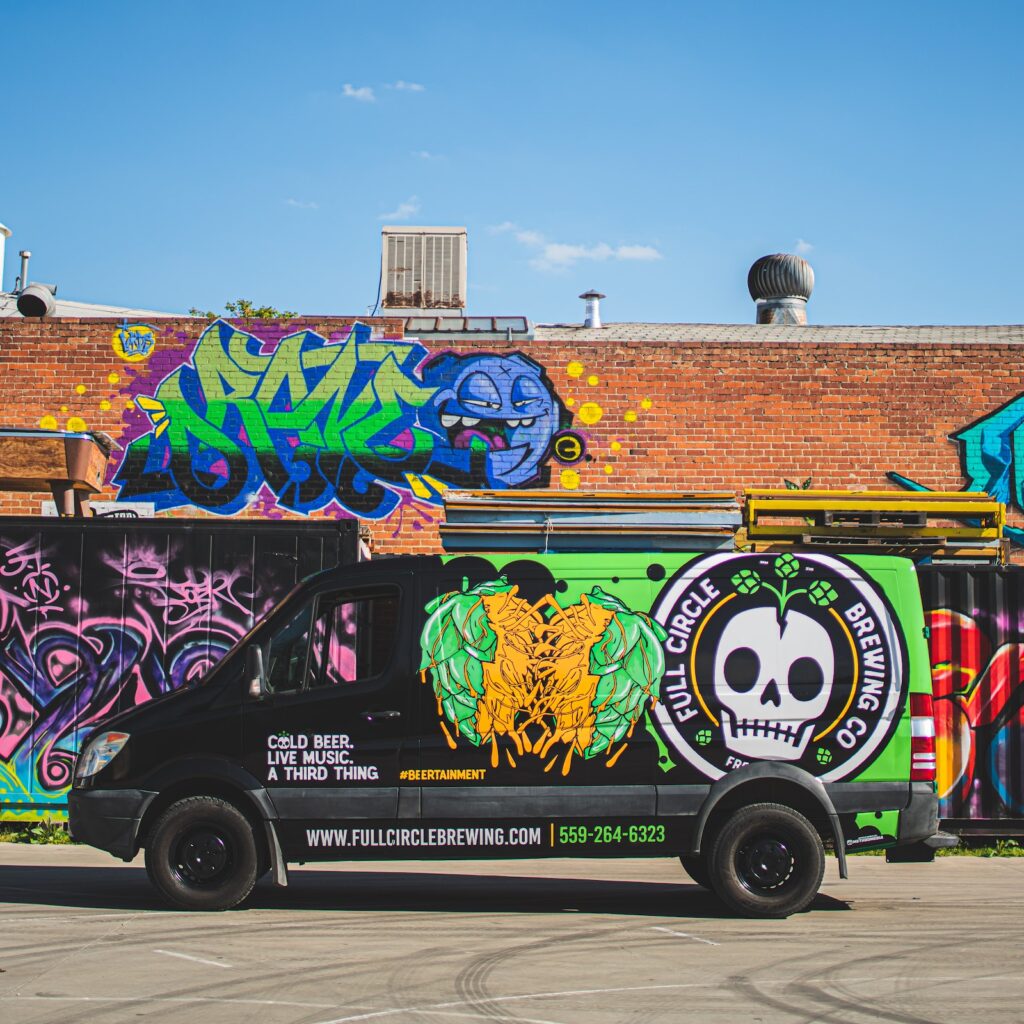 van in front of graffiti wall