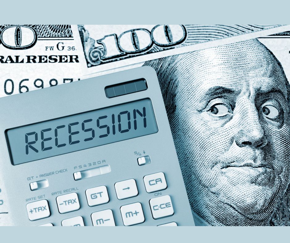 calculator says recession on top of a $100 dollar bill with ben frankling looking worried