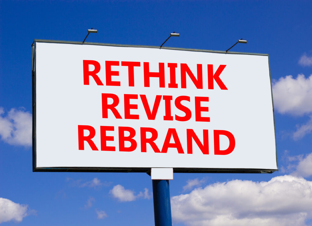 banner sign says rethink revise rebrand