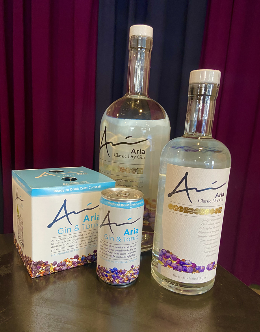 BOTTLES AND CANS OF ARIA GIN